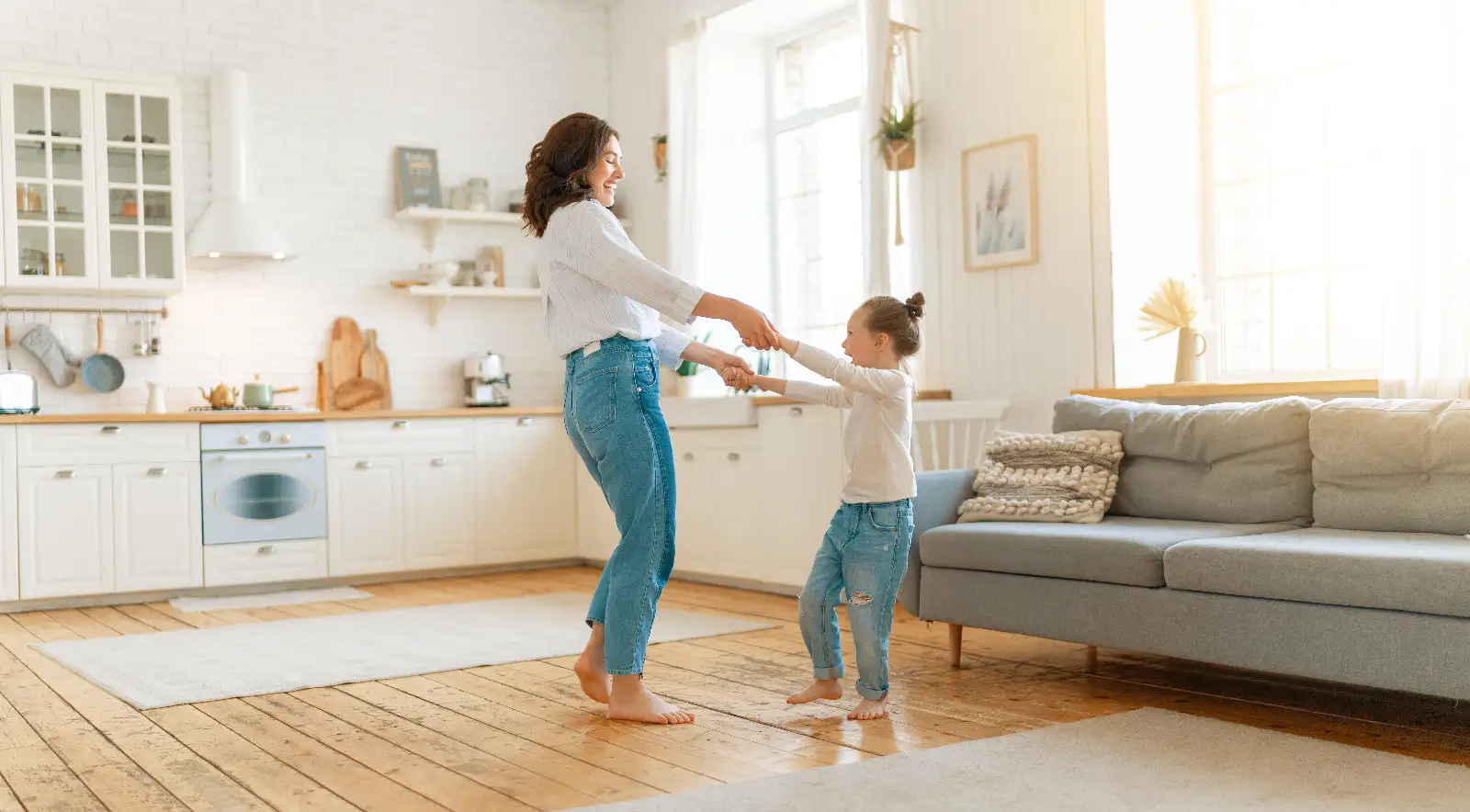 Mom and her daughter child girl are dancing. Family holiday and togetherness.